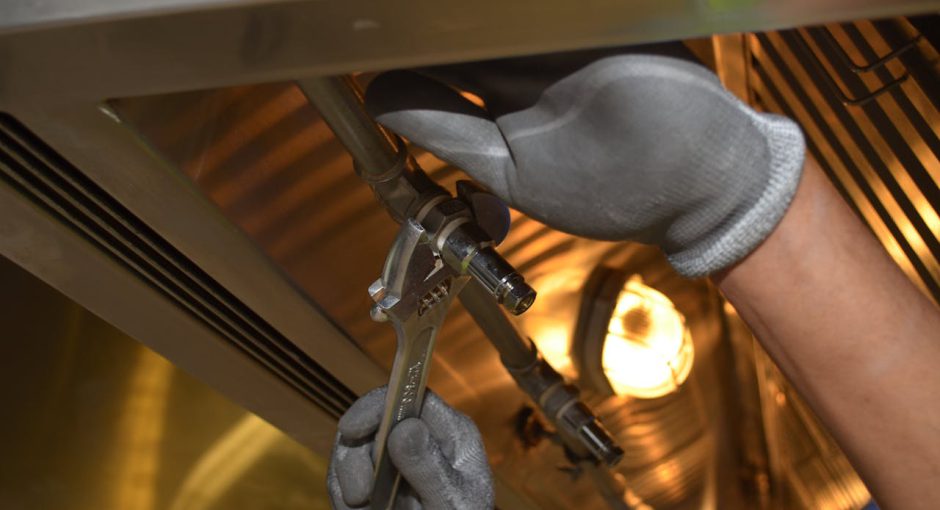 close-up-of-man-using-a-spanner